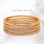 Diamond-Cut Gold Bangles Set with Sparkling Stone