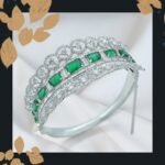 Silver-Tone Bangle with Emerald Stones